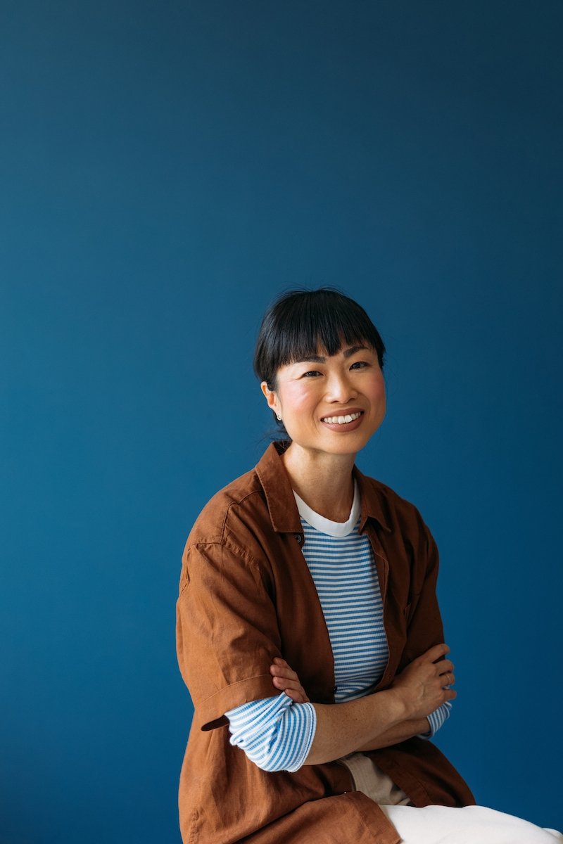 Lady infront of a blue background