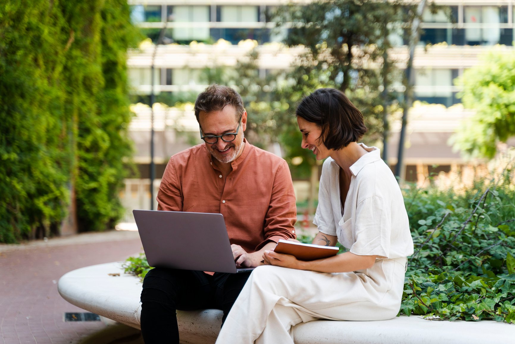 Two people working outdoors